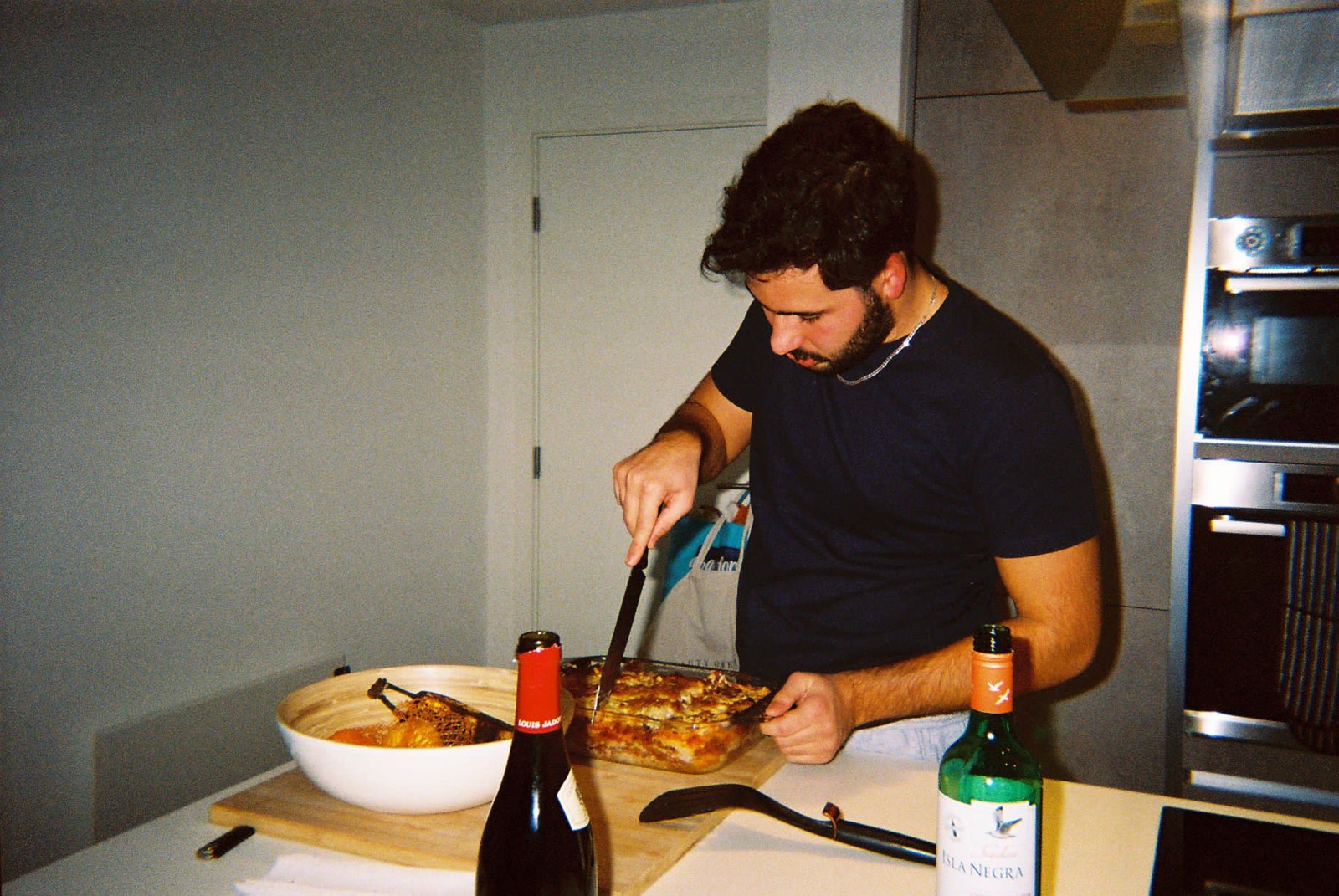 Cutting a lasagna, shot on film