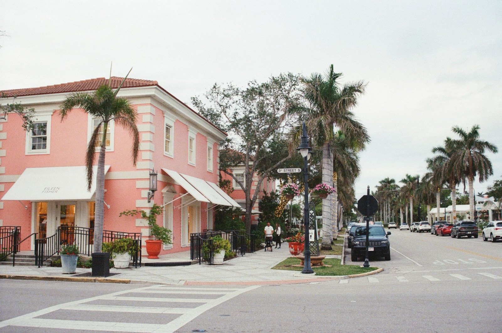 A pink corner building in Naples, Florida, on film
