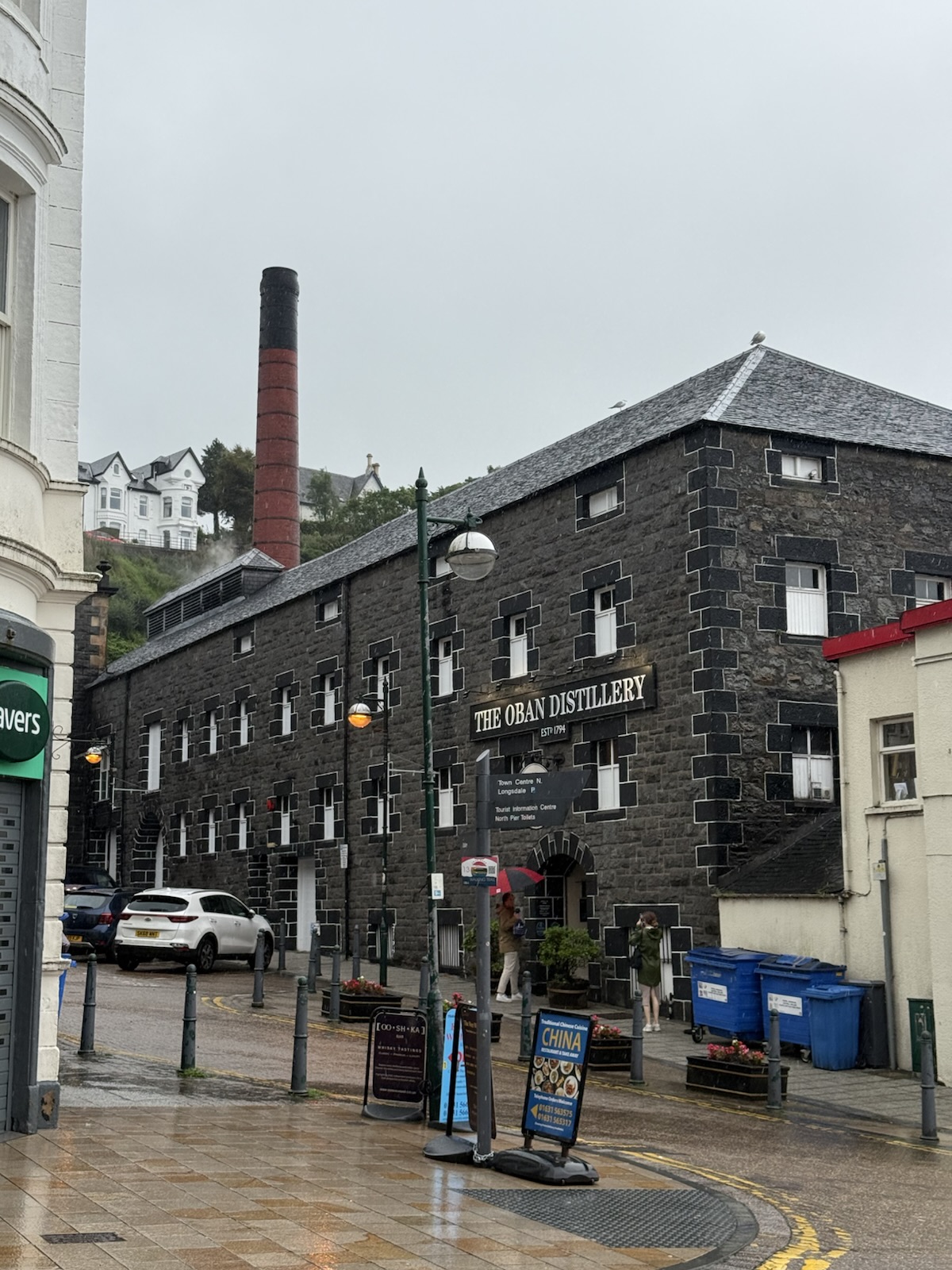 Oban distillery on a wet street
